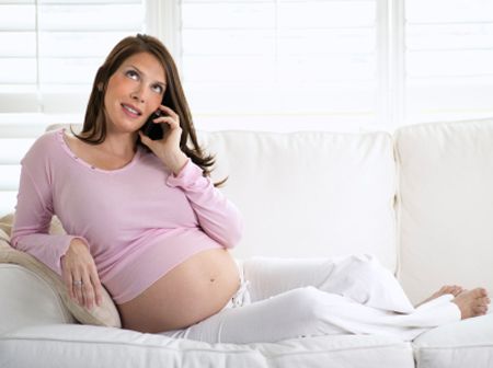 Pregnant woman relaxing on a couch